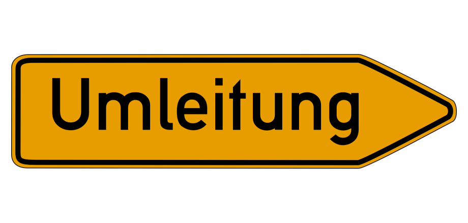Das typische Umleitungsschild im Straßenverkehr. Ein gelber Pfeil wo in schwarzer Schrift das Wort Umleitung steht.