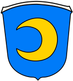 In diesem Bild sehen Sie das Wappen der Gemeinde Halbemond. Der Hintergrund ist blau. Im Vordergrund befindet sich ein gelber Halbmond. 