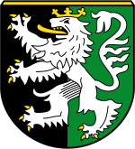 Wappen Gemeinde Lütetsburg Auf diesem Bild sehen Sie das Wappen der Gemeinde Lütetsburg. Der Hintergrund ist auf der linken Hälfte schwarz und auf der rechten Hälfte grün. Im Vordergrund befindet sich ein gekrönter Löwe.